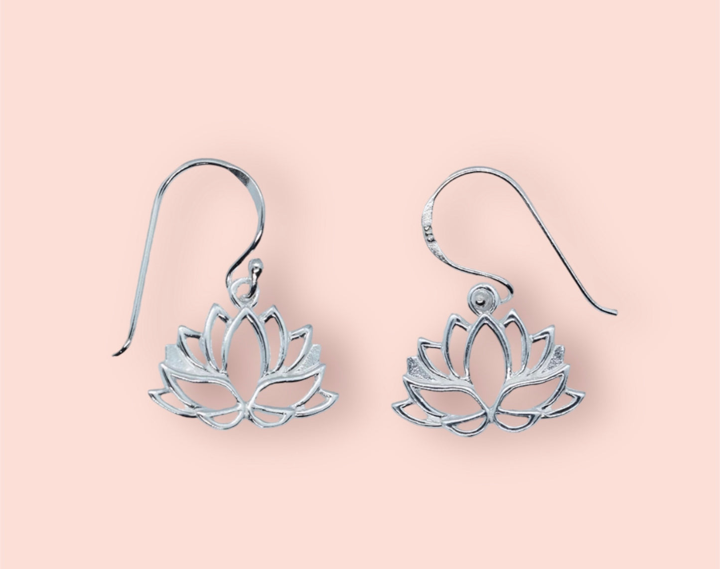 A pair of sterling silver lotus flower earrings with a vintage-inspired design.