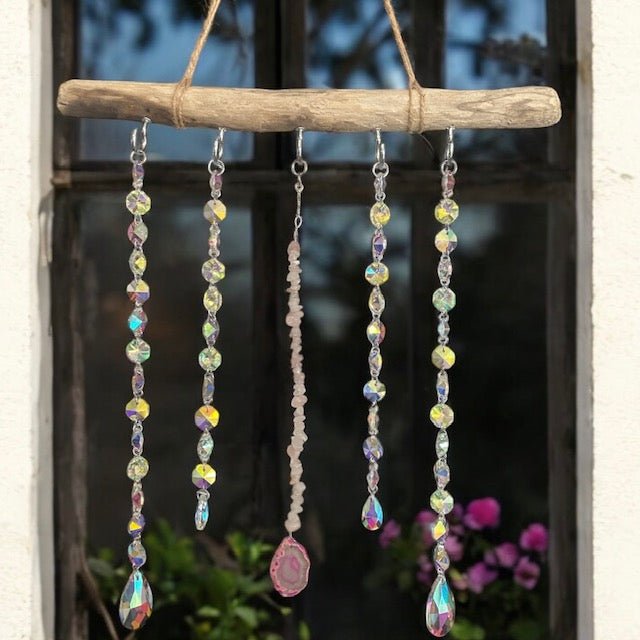 Boho celestial sun catcher accessory with hanging crystals to reflect light and create rainbows