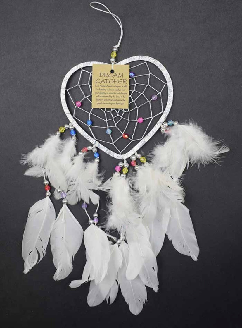 A small 5cm heart-shaped dream catcher with white feathers and multicolored beads, intended for hanging above a bed.