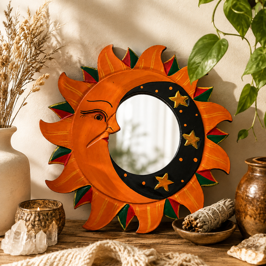 Hand-carved Sun and Moon mirror displayed in a warm boho sacred space