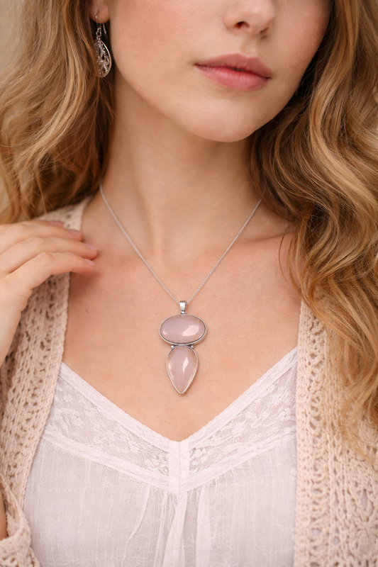 Woman wearing rose quartz  necklace with a 2 pink rose quartz pendants