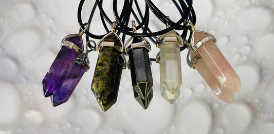 Crystal wand pendant on cord necklace, spiritual accessory for energy, clarity and mindfulness.