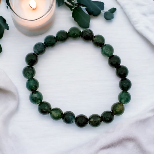 Healing moss agate gemstone bead bracelet, spiritual accessory for growth and harmony.