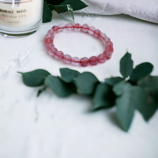 Healing cherry quartz gemstone bead bracelet, spiritual accessory for positivity and balance.