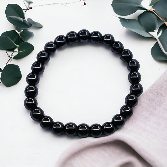 Healing hematite gemstone bead bracelet, spiritual accessory for balance and stability.