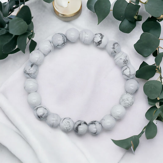 Healing howlite gemstone bead bracelet, spiritual accessory for peace and mindfulness.