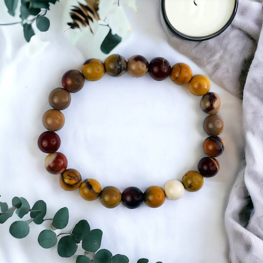 Healing mookaite gemstone bead bracelet, spiritual accessory for stability and inner growth.