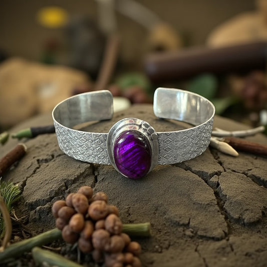 silver purple labradorite bracelet on woodland background