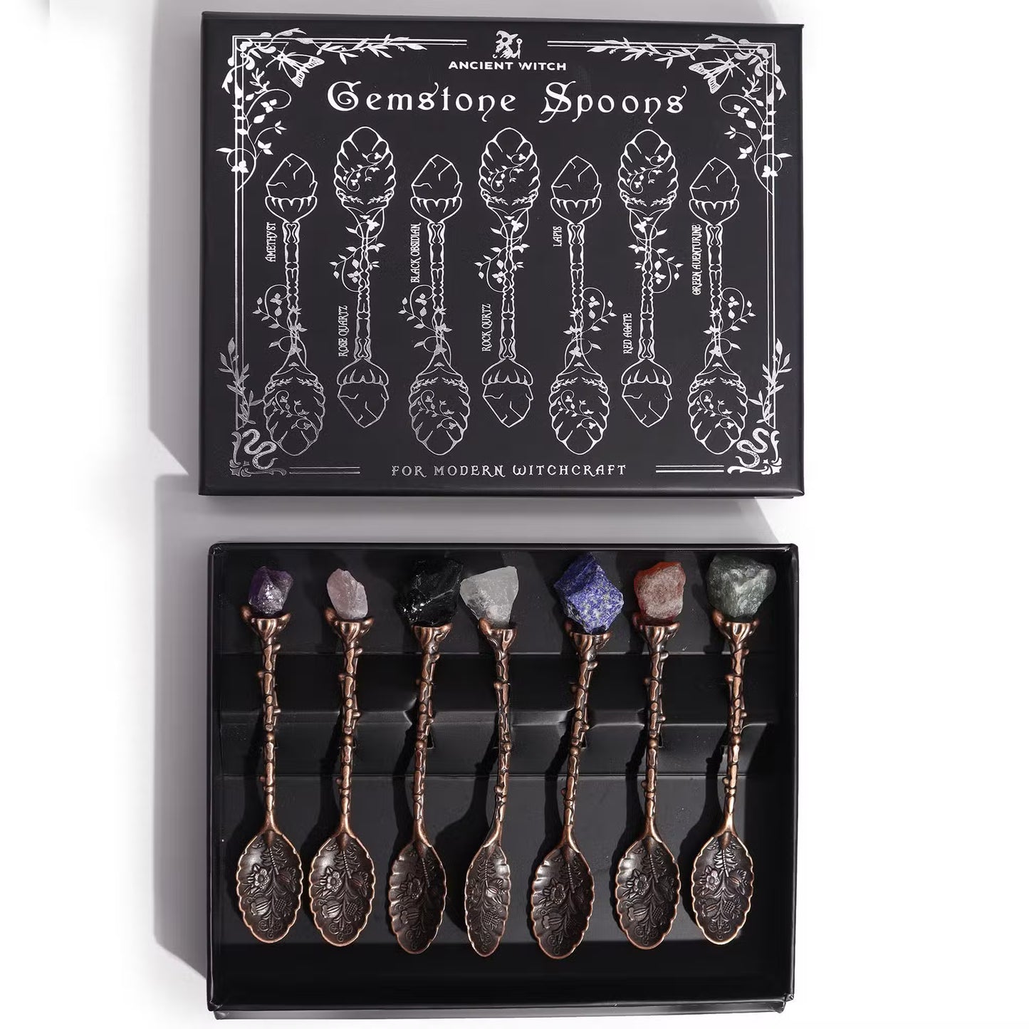 Set of 7 gemstone ritual spoons with bronze-toned floral handles